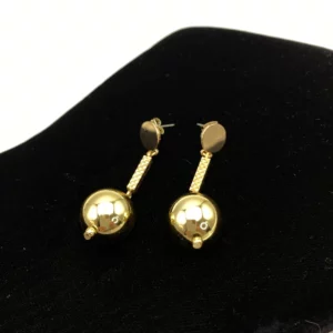 Boucles d'oreilles avec pendant boule dorée